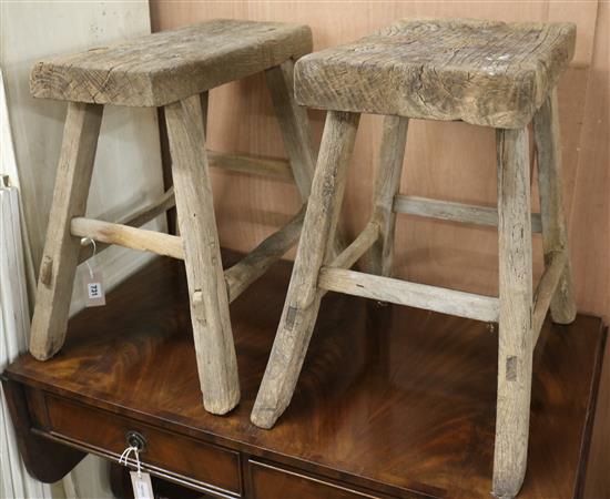 Two similar 19th century rustic stools W.49.5 and 45cm